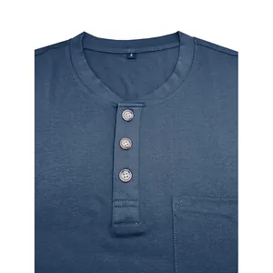 Close-up detail of a navy blue men's Henley shirt showing buttons and chest pocket.