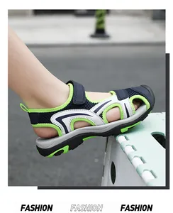 Detailed view of breathable closed-toe children's sports sandals in navy blue and lime green