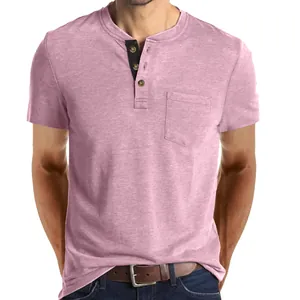 Close-up of pink men's short-sleeve Henley shirt with buttoned placket and pocket.