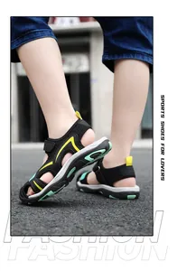 Children's breathable closed-toe sports sandals with stylish mesh design in black.