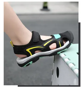 Side view of children's closed-toe sport sandals with breathable mesh and velcro straps
