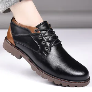 Close-up of black and brown low-top men's leather Martin boots with lace-up design
