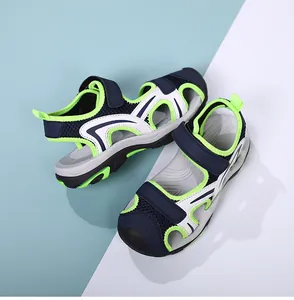 Boys' closed-toe breathable sport sandals with navy blue and neon green accents