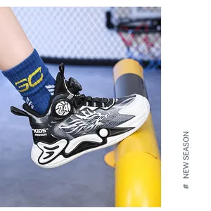 Close-up detail of boys' basketball shoe featuring dragon pattern and rotary buckle