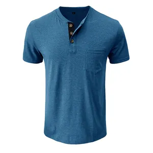 Macro detail of blue short-sleeve Henley shirt with wood buttons and chest pocket.