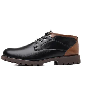 Side view of men's low-top work boots with black and brown leather patchwork design
