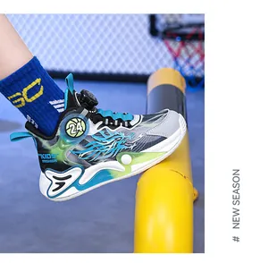 Side view of boy's basketball shoe with breathable mesh and rotary button lacing