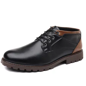 Side view of black men's low-top Martin boots with brown leather accents and lug sole.
