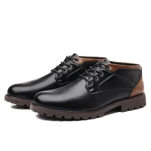 Detailed side view of men's low-top leather work boots in black and brown colorway.