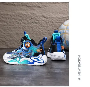 Close-up detail of boys' basketball shoes with blue dragon print and rotary dial buckle
