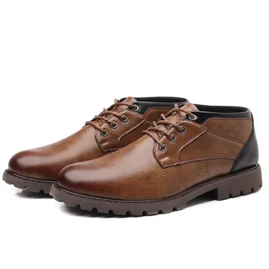 A detailed side view of men's brown faux leather low-top work boots with laces