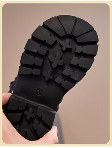 Detailed macro view of the anti-slip rubber sole for children's black Martin boots