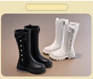 Elegant girls' high-top boots with decorative bows and pearls in black and white colors