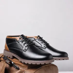 Detailed side view of black and brown men's low-top Martin boots on a leather bag