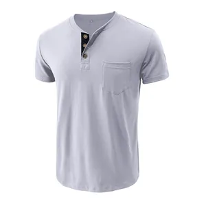 Detail of grey men's short-sleeved Henley shirt with three buttons and chest pocket.