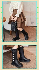 Detailed view of girls' black high-top Martin boots featuring side bow and lace-up accents