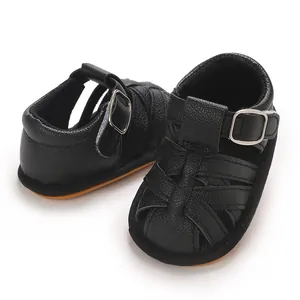 Detailed view of black breathable soft-sole sandals for baby boys' summer wear.