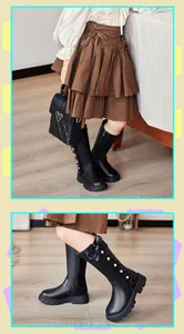 Close-up of black girls' high boots featuring decorative bow and pearl details