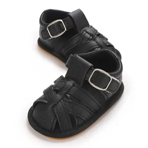 Detailed view of black breathable baby boy sandals featuring soft soles and buckle straps