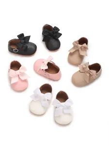 Variety of newborn baby girl princess shoes with large bow details in multi-colors.