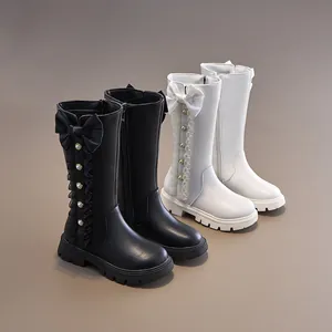 Princess-style high-top boots for girls featuring decorative bows and pearl accents