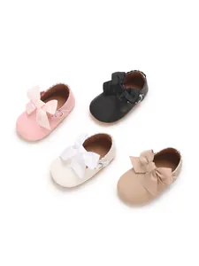 Soft PU leather baby princess shoes with large decorative bows shown in four colors
