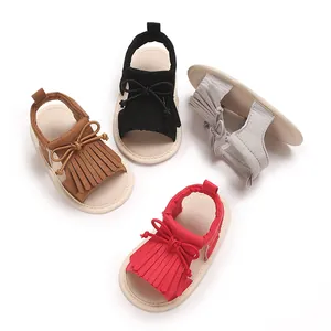 Assorted multi-colored baby girl sandals featuring stylish fringe and bow-knot details