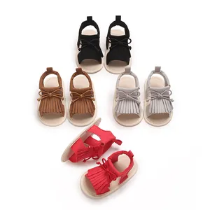 Variety of baby fringe soft sole sandals in black brown grey and red on white back