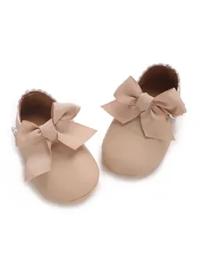 Beige PU leather baby girl princess shoes with large ribbed bow detail for newborns