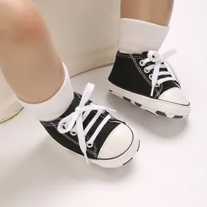 Classic black and white infant canvas sneakers for babies aged 0 to 1 year old