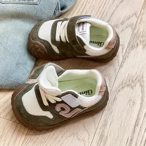Breathable mesh toddler sneakers with soft soles in green and white colorway