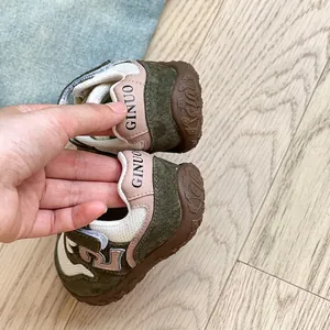Breathable mesh baby walking shoes with soft soles and olive green suede details