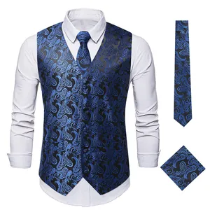 Detailed view of the blue paisley embroidery on men's formal vest, tie and pocket square