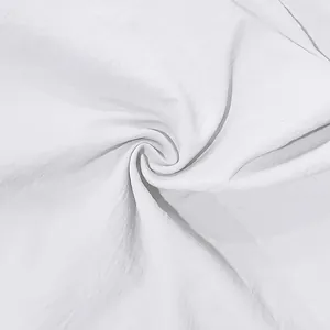 Detailed close-up of white breathable linen fabric texture for casual men's shirt