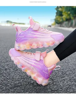 Detailed side view of pink and purple girls' sneakers featuring a decorative bubble sole