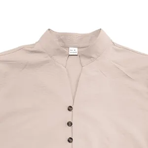 Detail close-up of men's casual shirt collar featuring Size M and 100% polyester label