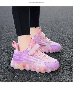 Detailed view of pink and purple girls sneakers with velcro strap and clear sole