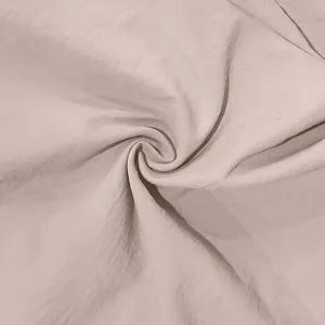 Detailed macro shot of breathable beige linen fabric texture for casual men's shirt
