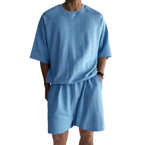 Detail view of men's light blue cotton terry lounge set with round neck t-shirt