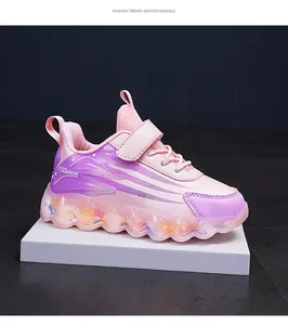 Detailed side view of pink and purple girls' sneakers with velcro straps and wavy soles