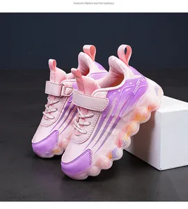 Detail view of pink and purple kids running shoes with hook-and-loop closure