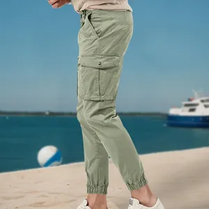 Side view of olive green men's cargo jogger pants featuring functional large flap pockets