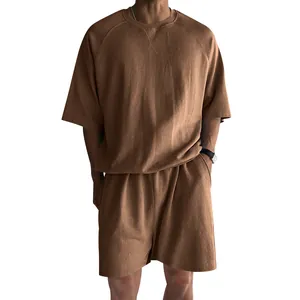 Detail of men's brown terry cloth casual lounge set with short sleeve t-shirt and shorts