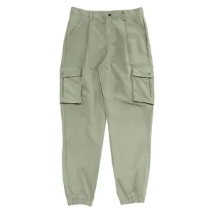 Detail view of men's sage green multi-pocket cargo pants with elasticated cuffs.