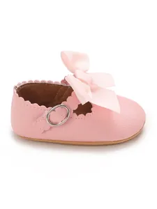 Detailed view of pink PU baby girl princess shoes featuring a large bowknot decoration