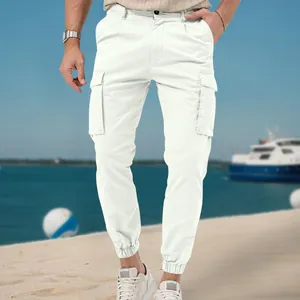 Detailed view of white men's cargo pants with multi-pockets and cuffed ankles