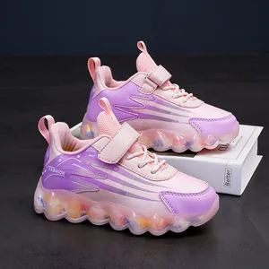 Pink and purple girls' sports shoes with adjustable velcro strap and soft wavy sole for kids
