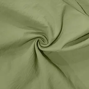 Macro close-up view of breathable sage green linen fabric showing natural soft texture