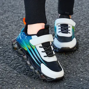 Durable kids' running shoes with velcro straps and stylish bubble soles in blue and white