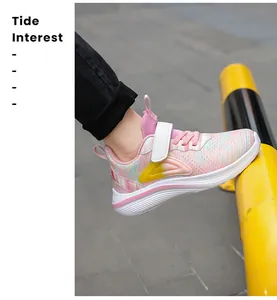 Close-up of pink multicolored mesh girls running shoes in outdoor setting